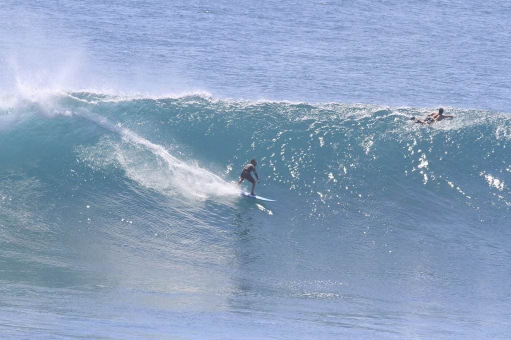 Surfing big waves at Uluwatu
