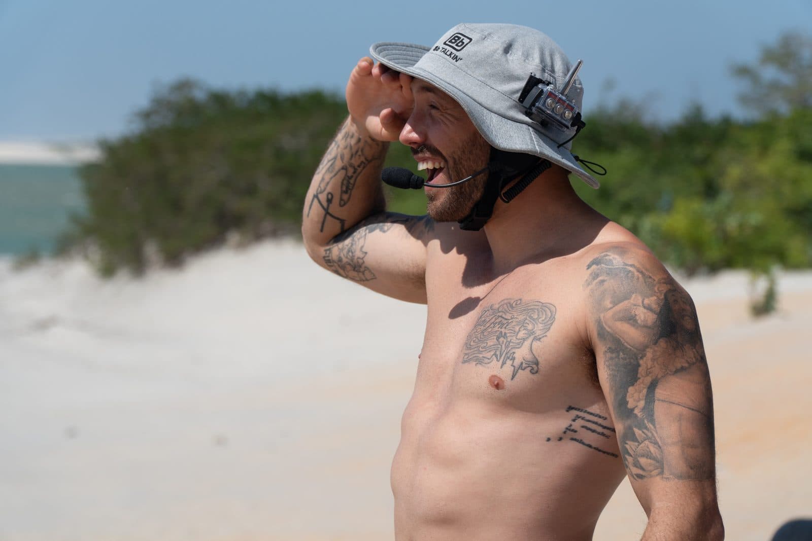 Mike watching his riders on the water, radio on his hat